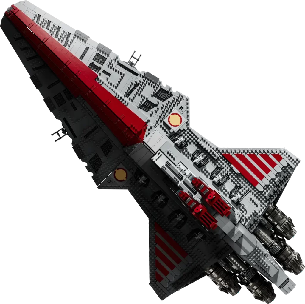 A detailed LEGO model inspired by the Revealed: UCS Star Wars™ Venator-Class Republic Attack Cruiser, featuring a sleek design with grey and red colouring, multiple rear engines, and intricate structural details on top.