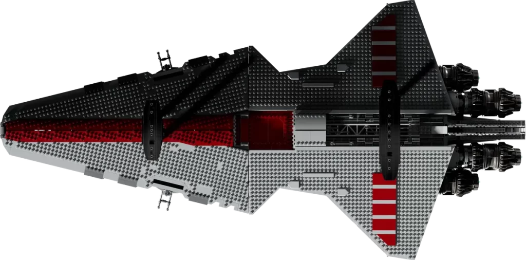 A LEGO model of the Revealed: UCS Star Wars™ Venator-class Republic Attack Cruiser, featuring a large, angular spaceship with a dark and light grey colour scheme, red accents, and detailed rear engines, viewed from above on a black background.